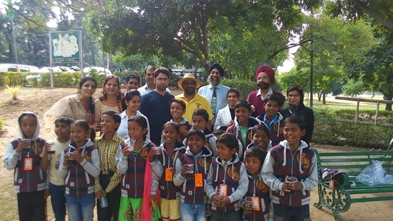 Children and adults gathered outdoors for a Nihal Foundation community activity